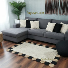 Load image into Gallery viewer, Gray sectional sofa with decorative pillows on a wooden floor, featuring a Rugskart.com rug.