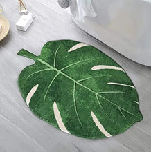 Load image into Gallery viewer, Green leaf-shaped rug on a bathroom floor
