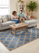 Load image into Gallery viewer, Family sitting on a gray sofa with a blue patterned rug in a living room.
