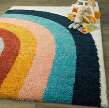 Load image into Gallery viewer, Colorful shaggy rug with a rainbow pattern on a wooden floor.
