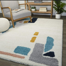 Load image into Gallery viewer, Decorative rug with abstract patterns in a living room setting

