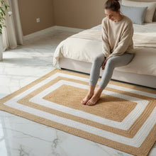 Load image into Gallery viewer, Woman sitting on a patterned rug in a bedroom
